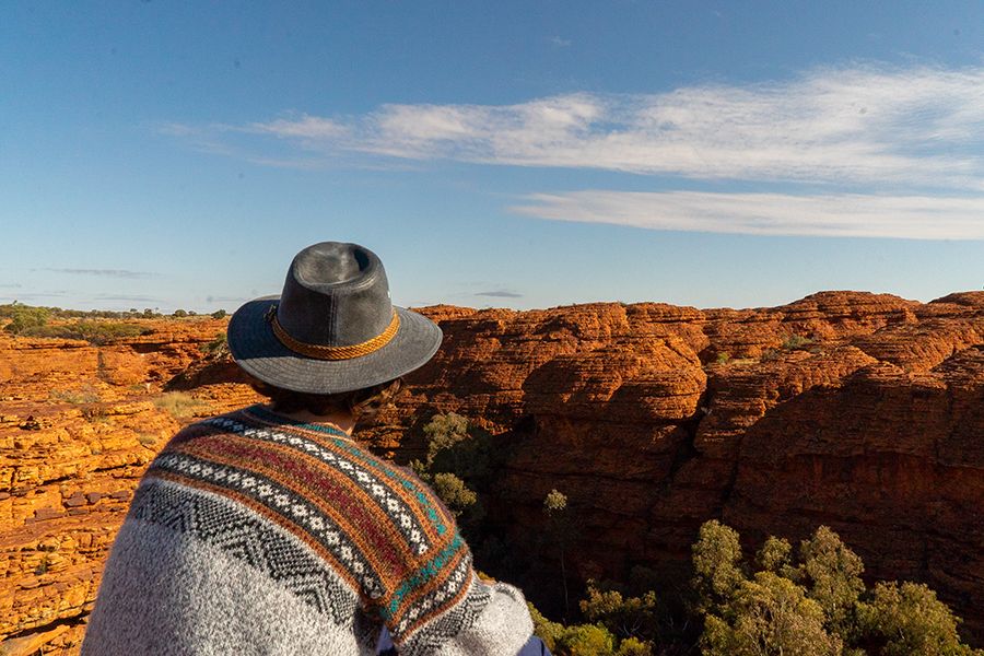 man admiring rugged gorge walls in outback australia