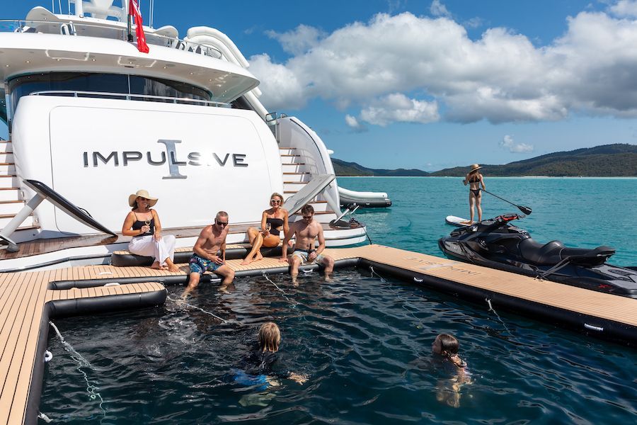 Impulsive Superyacht people gathered around impulsive superyacht