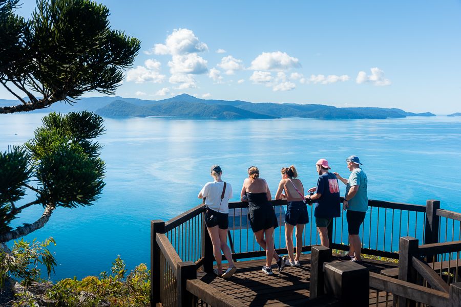 Whitsunday Islands travellers admiring whitsunday islands from a lookout