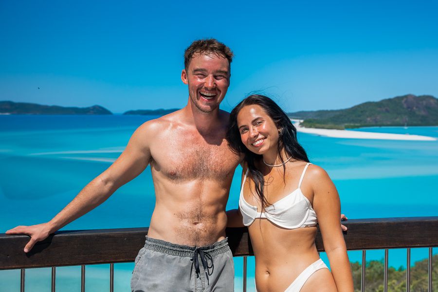 a man and woman standing at the hill inlet lookout