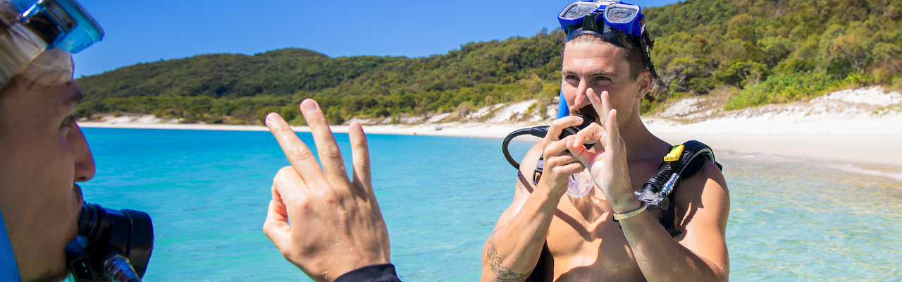 Two scuba divers getting ready for a dive