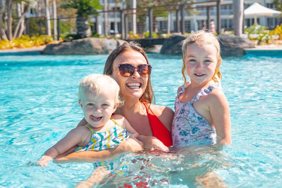 Daydream Island Resort family playing in the pool at daydream island resort