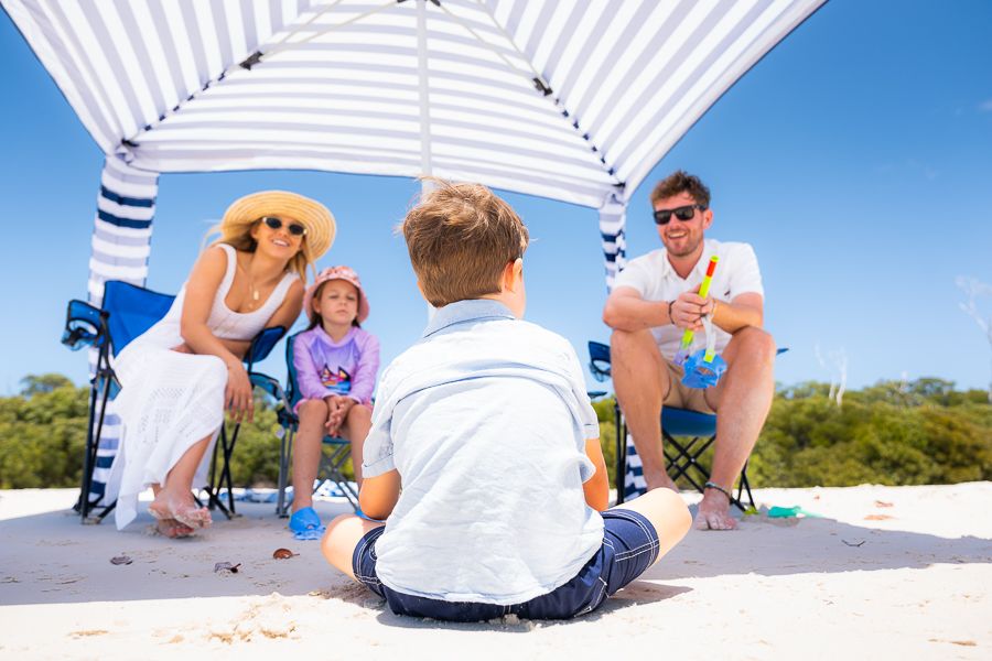 Whitehaven Beach Family family gathered on whitehaven beach whitsundays