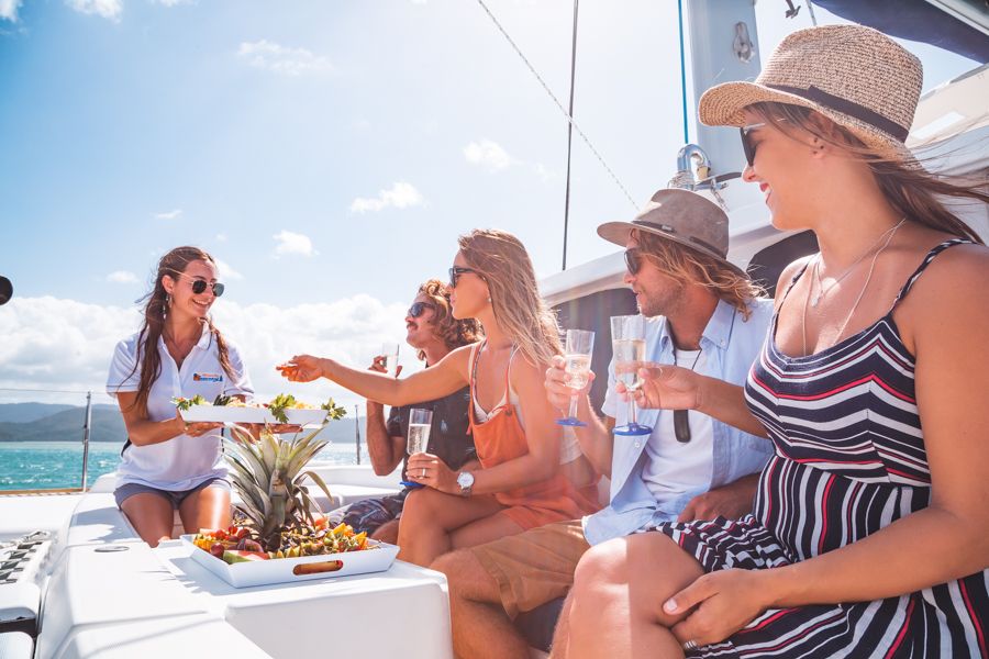 Crew offering fresh food to guests, Whitsundays, Australia