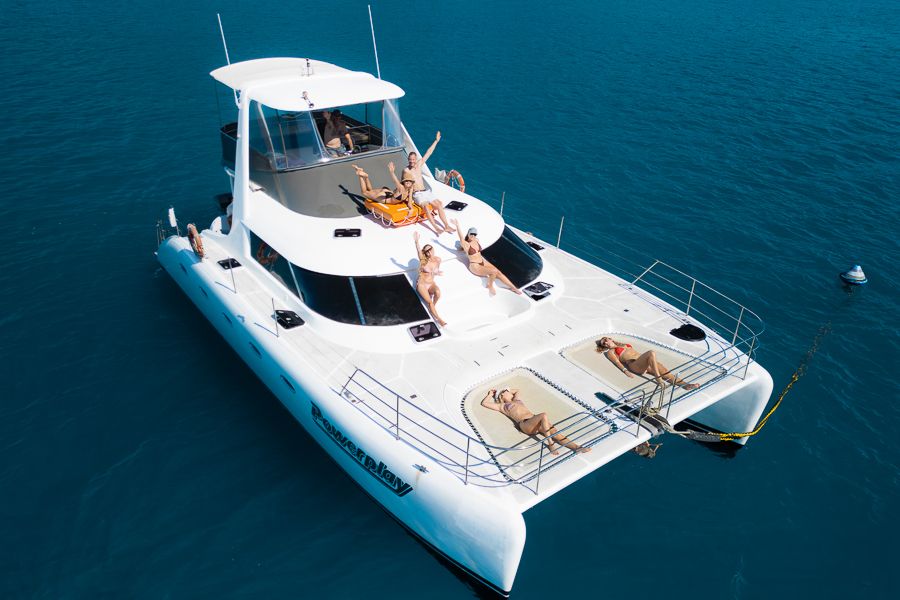 Guests on top deck of Powerplay catamaran