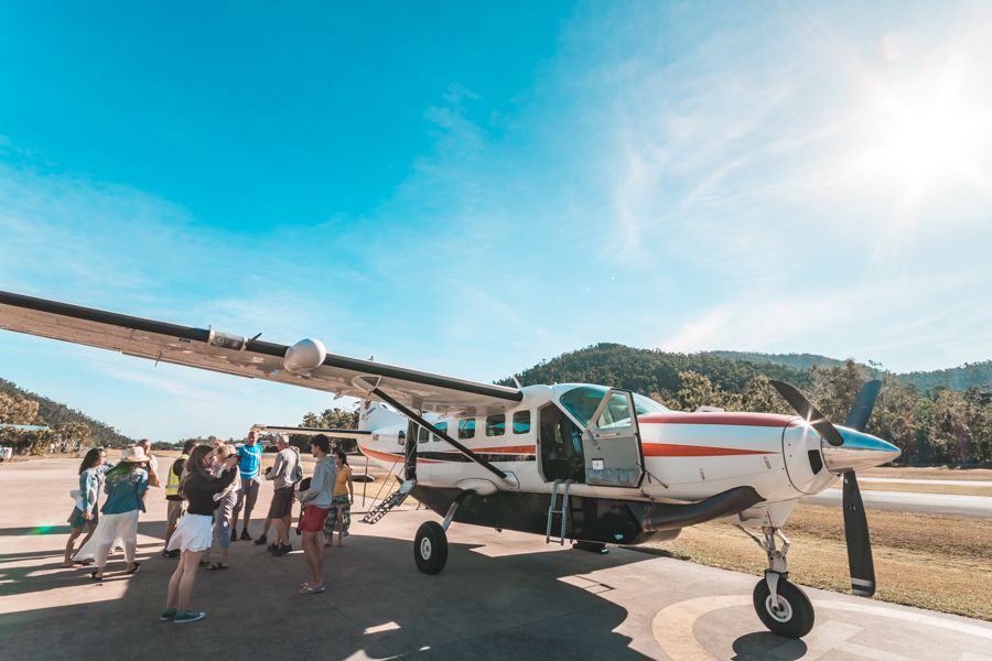 guests boarding a Scenic Flight from airlie beach in the whitsundays