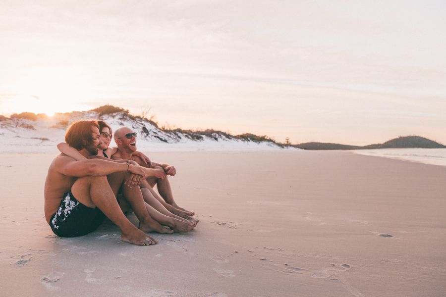 people on the beach at sunset