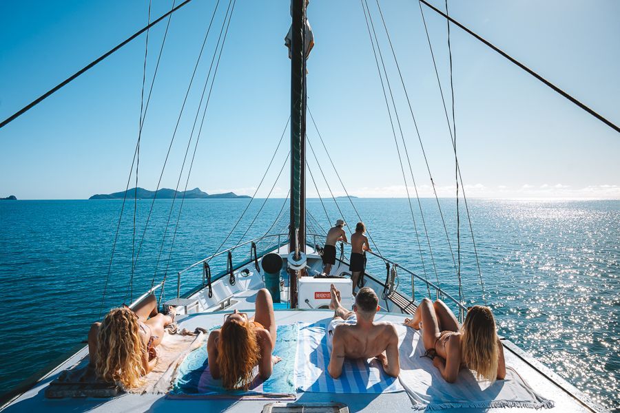 travellers sailing on a yacht in the whitsundays