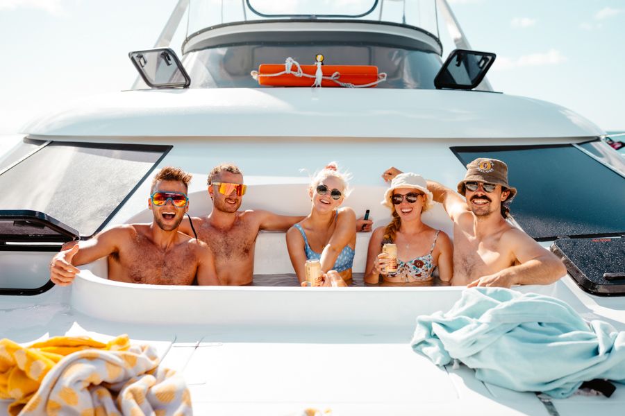 Friends in a hot tub aboard Powerplay