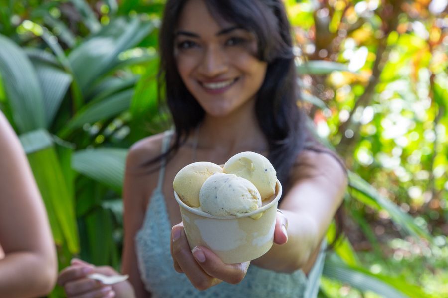 girl holding cup of ice cream in daintree rainforest