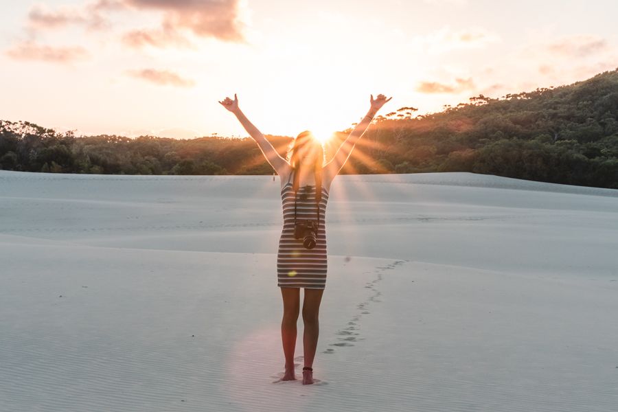 girl posing on sand dunes